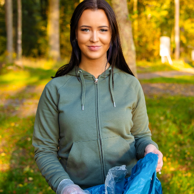 young-smiling-female-volunteer-holding-garbage-bag-VQ4WFX6.jpg